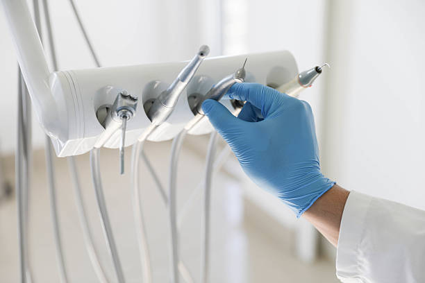 Professional Tooth Extraction technician working in Golden Shores, AZ